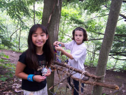 Photo: two girls in the woods